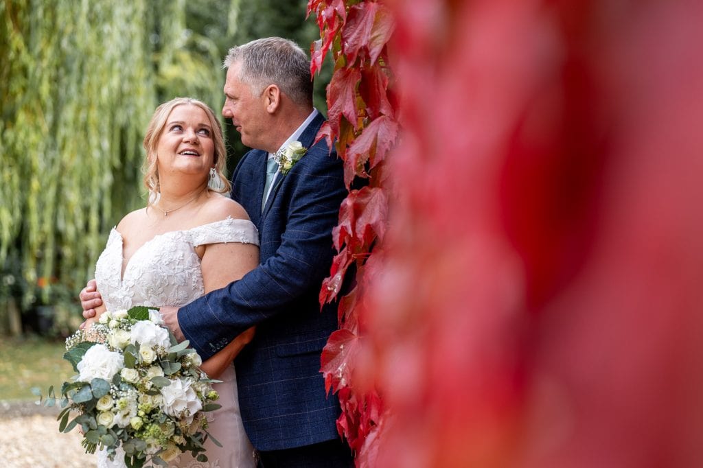 bride and groom outside Plum Park in October, Towcester, Northants