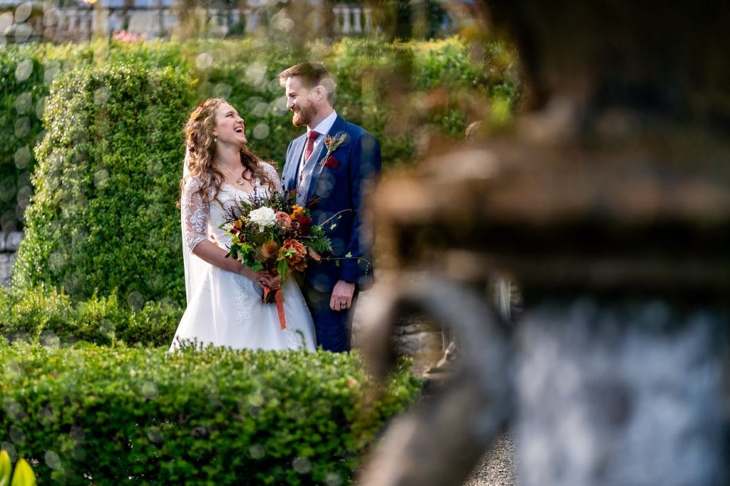 Thornbridge wedding couple next to the fountain.